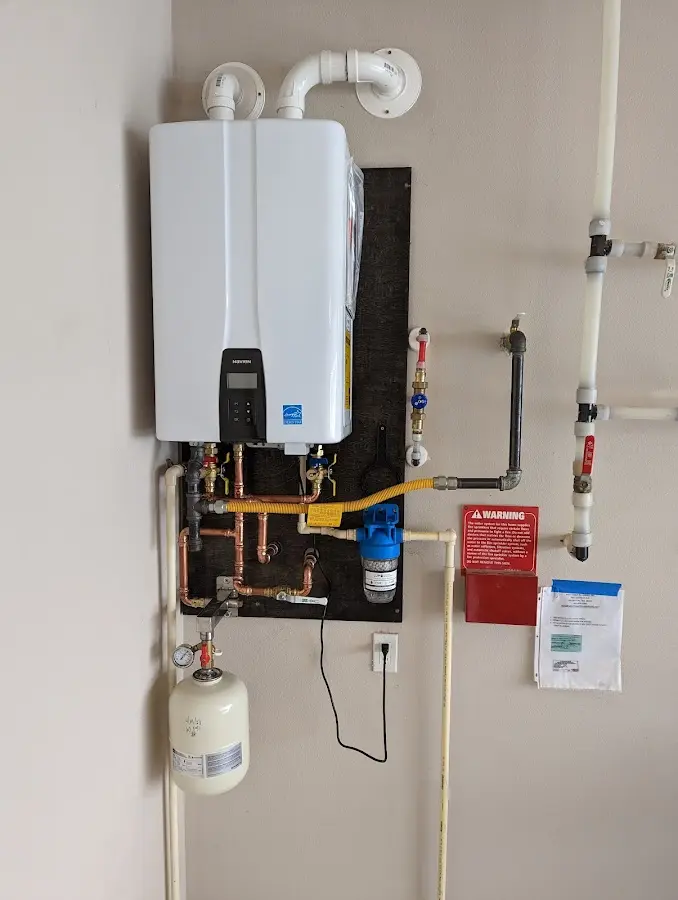 Professional plumber installing copper piping in a Strasburg home